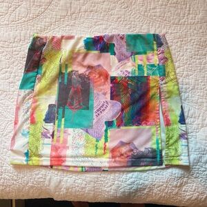 Beginning boutique colorful print mini skirt with slit! Worn twice!